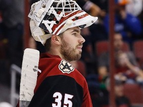 Arizona Coyotes' Louis Domingue pauses during the third period of his team's 1-0 victory over the New York Islanders on Dec. 19, 2015, in Glendale, Ariz.  The Coyotes' Domingue earned his first NHL shutout. (ROSS D. FRANKLIN/AP)
