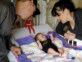 Graham and Maureen Wright with their baby Faith in their room at the  pediatric ward at Kingston General Hospital on Friday December 18 2015. Jolson Lim/The Kingston Whig-Standard/Postmedia Network
