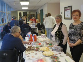 Members of the LMHA show off their baking items during their annual Christmas fundraiser.