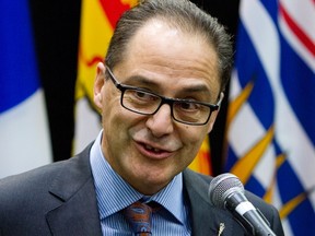 Alberta Finance Minister Joe Ceci talks to reporters before the start of a meeting with Federal Finance Minister Bill Morneau and his provincial and territorial counterparts, in Ottawa, on Monday, Dec. 21, 2015. THE CANADIAN PRESS/Fred Chartrand