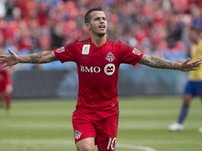 Toronto FC's Sebastian Giovinco celebrates after scoring his team's second goal against Colorado Rapids during first half MLS action in Toronto on September 19, 2015. THE CANADIAN PRESS/Chris Young