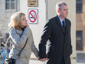 Dennis Oland and his wife Lisa head to the Law Courts where he was found guilty of second degree murder in the death of his father, Richard Oland, in Saint John, N.B. on Saturday, Dec. 19, 2015. The New Brunswick police commission is going to examine how the Saint John police force handled the Richard Oland murder. THE CANADIAN PRESS/Andrew Vaughan