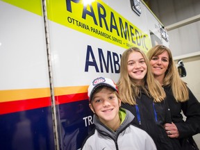 Jodi Empey and her daughter Lindsay, 12, and son Sam, 11. Empey helped raised the funds for the new ambulance, a cause that was dear to her heart after she needed transportation in 1999 when her son Scotty was born prematurely. (Dani-Elle Dube/Ottawa Sun/Postmedia Network)