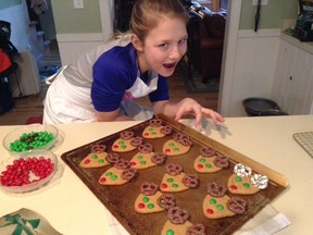 Granddaughter Rachel, wearing an apron she made with Barbara Wamboldt, shows off her reindeer cookies baked for her class. 
Supplied Photo