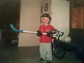 A young Ryan Cranford plays hockey in the basement of the family home.
(Supplied photo)