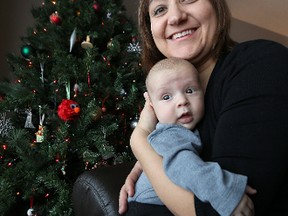 Alyssa Thiessen holds her son Noah in their Transcona home on Tues., Dec. 22, 2015. Noah has been one of the more popular names for boys in the province in recent years but didn't crack the top 10 so far for 2015.