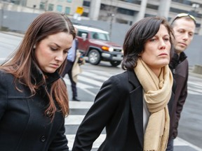 Bridgette McGregor, 27, and sister Christy McGregor, 42, arrive at court to testify for the defence in the murder trial of Const. James Forcillo Tuesday, December 22, 2015. The women were on the streetcar when Sammy Yatim pulled a knife. (Dave Thomas/Toronto Sun)