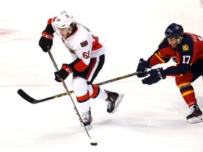 Ottawa Senators left wing Mike Hoffman (68) skates with the puck as Florida Panthers center Derek MacKenzie (17) defends in the second period at BB&T Center. (Robert Mayer-USA TODAY Sports)