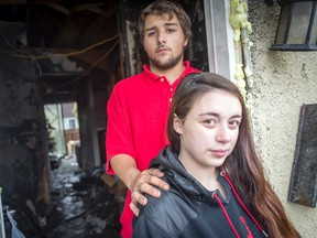 Brian Enache and his girlfriend Bryanna St.-Martin spent Tuesday, Dec. 22, 2015, trying to salvage possessions from their Southvale Cr. home, which was gutted by fire early Monday morning. St.-Martin was due to give birth Tuesday, but, she said she hopes the baby will wait so she can help her family clean the mess created when their townhouse was destroyed by fire Monday morning.
Dani-Elle Dube, Ottawa Sun/Postmedia Network