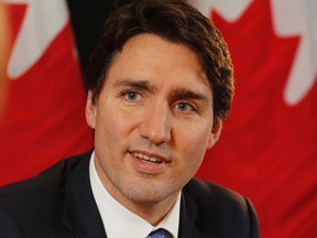 Prime Minister Justin Trudeau speaks with reporters during an interview with The Canadian Press in Ottawa on Wednesday, December 16, 2015. THE CANADIAN PRESS/ Patrick Doyle