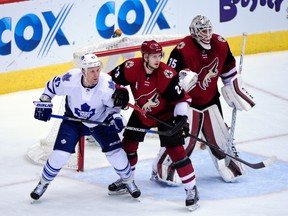 Toronto Maple Leafs centre Leo Komarov (47) looks for the puck as Arizona Coyotes goalie Louis Domingue (35) and defenceman Oliver Ekman-Larsson defend Tuesday at Gila River Arena. (Matt Kartozian/USA TODAY Sports)