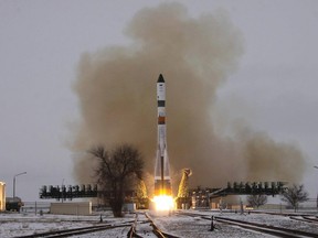 In this photo released by the Roscosmos  the Progress spacecraft blasts off Monday, Dec. 21, 2015, from Russia's space launch complex in Baikonur, Kazakhstan, to dock with the space station two days later. It is delivering 2.5 metric tons of fuel, water, food and other supplies. (Russian Federal Space Agency photo via AP)