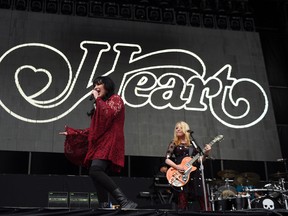 Ann Wilson, left, and Nancy Wilson of the band Heart perform at RFK Stadium on Saturday, July 4, 2015, in Washington. (Photo by Nick Wass/Invision/AP)