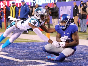 New York Giants wide receiver Odell Beckham Jr. (13) catches a touchdown pass in front of Carolina Panthers corner back Josh Norman (24) during the fourth quarter at MetLife Stadium. The Panthers defeated the Giants 38-35. Brad Penner-USA TODAY Sports