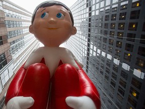 The Elf on the Shelf balloon floats down Sixth Avenue during the 88th Annual Macy's Thanksgiving Day Parade in New York  in this Nov. 27, 2014 file photo. REUTERS/Andrew Kelly
