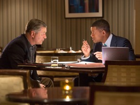This photo provided by Columbia Pictures shows, Alec Baldwin, from left, as Dr. Julian Bailes, and Will Smith as Dr. Bennet Omalu, in a scene from Columbia Pictures' "Concussion." The movie releases in U.S. theaters on Dec. 25, 2015. (Melinda Sue Gordon/Columbia Pictures via AP)