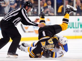 St. Louis Blues right wing Ryan Reaves (75) takes down Boston Bruins right wing Tyler Randell (64) during a fight in the third period of the St. Louis Blues 2-0 win over the Boston Bruins at TD Garden. Winslow Townson-USA TODAY Sports