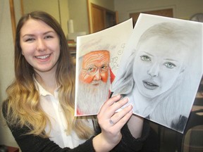CORRECTED VERSION....Young artist Dana Nikiforuk, at her school in Centreville, near Kingston, Ont. on Friday, Dec. 17, 2015, shows a picture of Santa she drew for a contest. Michael Lea The Whig Standard Postmedia Network