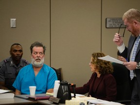 Robert Lewis Dear glares at his attorney Daniel King during an outburst in court appearance on Wednesday, Dec. 9, 2015, in Colorado Springs, Colo. Dear, accused of killing three people and wounding nine others at a Colorado Springs Planned Parenthood clinic on Nov. 27, plans to represent himself. (Andy Cross/The Denver Post via AP, Pool)