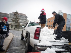 OTTAWA - Dec 23, 2015 - A crew from Go Green LTD helped make a white Christmas possible for Rogers House by collecting snow from local arenas and delivering it to the hospice centre for kids Wednesday. The snow was placed in the garden and kids got to enjoy some hot chocolate, Timbits and a friendly snowball fight. (DANI-ELLE DUBE/OTTAWA SUN/POSTMEDIA NETWORK)