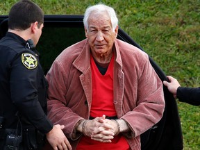 In this Oct. 29, 2015, file photo, former Penn State University assistant football coach Jerry Sandusky arrives at the Centre County Courthouse for an appeal hearing in Bellefonte, Pa. The university’s audited financial statements dated Oct. 30, 2015, for the year that ended June 30, show that Penn State settled with six more of Sandusky's victims or accusers for $33.2 million in new payments over claims. According to the audit, that puts the school’s total payout at nearly $93 million. (AP Photo/Gene J. Puskar, File)