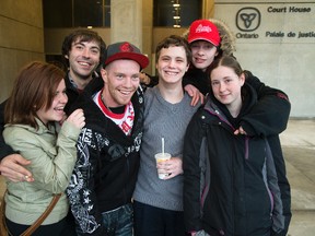 Kodey Wheeler (fourth from left) is surrounded by friends and family after being released on bail in London, Ont. on Wednesday December 23, 2015. He had spent the last six months at the Elgin Middlesex Detention Centre. With him are L to R Jennifer Hoffman, Devon Cross, Patrick Bennett, Sheldon Watson and Mikenzee Wheeler. (DEREK RUTTAN, The London Free Press)