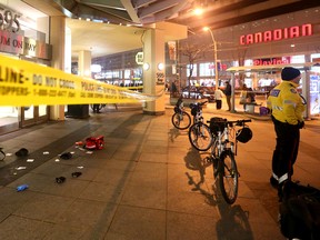 Toronto Police on scene after a man was attacked with a machete near Bay and Yonge on Wednesday, December 23, 2015. (Dave Abel/Toronto Sun)