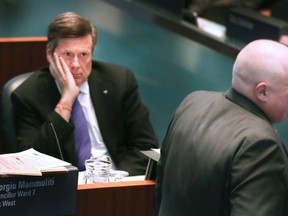 Toronto Mayor John Tory, with Councillor Rob Ford, on Wednesday, Feb. 11, 2015 during a council meeting in Toronto. (Veronica Henri/Toronto Sun)