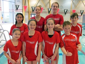Eight members of the Sarnia Y Rapids one swim team earned top spot in at least one event at the St. Clair Erie Aquatic League meet in Leamington Dec. 13. Back row from left are Susan Wu, Diane Clarke, Greg Dietrich and Tyler Murphy. Front row from left are Ali Page, Jessie Hillier, Lauren Armstrong, and Trevor Marut. Handout/Sarnia Observer/Postmedia Network