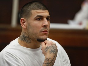 Former New England Patriots NFL football player Aaron Hernandez attends a pre-trial hearing at Suffolk Superior Court, Tuesday, Dec. 22, 2015, in Boston. Hernandez is charged with killing two Boston men in 2012 after a chance encounter at a nightclub. (AP Photo/Steven Senne, Pool)