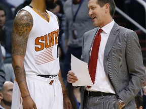 Suns head coach Jeff Hornacek (right) talks with Markieff Morris (left) during first half NBA action against the Nuggets in Phoenix on Wednesday, Dec. 23, 2015. (Ross D. Franklin/AP Photo)