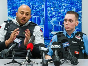 Paragon Security guards Nathaniel McNeil and Phillip Bonapart during a press conference in Toronto on Thursday, Dec. 24, 2015. (ERNEST DOROSZUK/Toronto Sun)