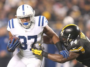 Former Colts running back Zurlon Tipton (left) was charged with criminal recklessness with a deadly weapon allegedly firing a gun outside a suburban Indianapolis home. (Charles LeClaire/USA TODAY Sports)