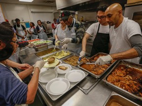 Volunteers were in full force at the Scott Mission on Spadina Ave. in Toronto on Christmas day serving up hundreds of turkey dinners to the less fortunate. (DAVE THOMAS/Toronto Sun)