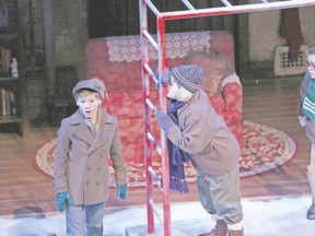 Hunter Burgess, centre, of Sarnia, is in a predicament as Josh Buchwald, left, and Callum Thompson look on in the Grand Theatre production of A Christmas Story. (Claus Andersen, Special to Postmedia News)