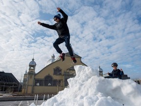 Christmas is a day for family and fun for most people, including Bruce Annan, who found a pile of snow left by a Zamboni at the Lansdowne Park Skating Court. Others, however, end up working Christmas Day. Some because they have to, others because they want to. THE CANADIAN PRESS/Justin Tang