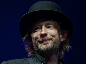 In a file picture taken on August 6, 2010 British musician Thom Yorke performs on the main stage at the Big Chill festival near Ledbury in Herefordshire. British singer Thom Yorke of Radiohead has written to Father Christmas to ask for "some hope for the future" for his children and no presents for "oil company executives" as part of the "Letters Live" initiative to celebrate letter writing and mark National Letter Writing Day on December 7, 2015.  AFP PHOTO / LEON NEAL