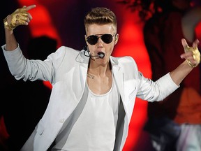 Justin Bieber performs during a concert at Palau Sant Jordi stadium in Barcelona in this March 16, 2013 file photo.   REUTERS/Albert Gea/Files
