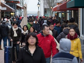 Shoppers fill the McArthurGlen Designer Outlet mall during Boxing Day in Richmond, B.C., on Saturday, Dec. 26, 2015. THE CANADIAN PRESS/Darryl Dyck