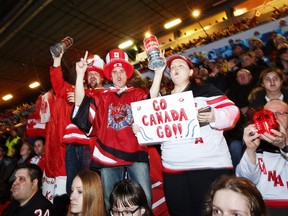 Supporters of Team Canada cheer during the World Junior Championship match against the U.S.A. in Helsinki Saturday, Dec. 26, 2015. (Roni Rekomaa/Lehtikuva via AP)
