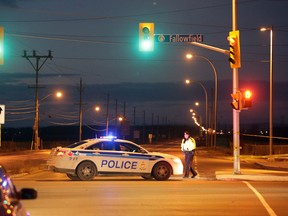 A police cruiser blocks Greenbank Rd. at Fallowfield after a fatal collision in Barrhaven on Christmas Day, Friday, December 25, 2015. MIKE CARROCCETTO / OTTAWA SUN / POSTMEDIA NETWORK