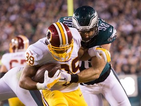Washington Redskins running back Pierre Thomas (39) rushes the ball and is tackled by Philadelphia Eagles outside linebacker Connor Barwin (98) during the second quarter at Lincoln Financial Field. (Bill Streicher/USA TODAY Sports)