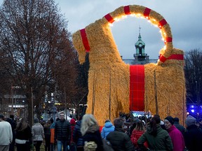 People gather at the inauguration of the Gavlebocken (Gavle Goat), which is a traditionally Christmas display, at Slottstorget (Castle Square) in central Gavle, Sweden, Nov. 29, 2015. REUTERS/Mats Astrand/TT News Agency