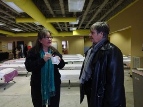 Cindy Bertolo, Salvation Army manager (left), and Sherry Frizzle of the North East LHIN, chat about the Out of the Cold program.