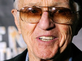 In this Oct. 21 2011, file photo, cinematographer Haskell Wexler poses at the premiere of the documentary film "Revenge of the Electric Car," at Tesla Motors in Los Angeles. (AP Photo/Chris Pizzello,File)