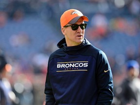 Denver Broncos quarterback Peyton Manning (18) has been implicated in investigation into illicit sports doping. Ron Chenoy-USA TODAY Sports