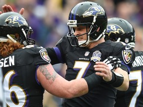 Baltimore Ravens quarterback Ryan Mallett celebrates his touchdown pass to wide receiver Chris Matthews with Ryan Jensen (66) during the first half of an NFL football game against the Pittsburgh Steelers in Baltimore, Sunday, Dec. 27, 2015. (AP Photo/Gail Burton)