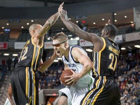 Niagara River Lions? Logan Stutz finds a hole between two London Lightning players during National Basketball League of Canada action at the Meridian Centre Sunday night in St. Catharines. The River Lions won 106-104. (Colin Dewar, Special to Postmedia News)