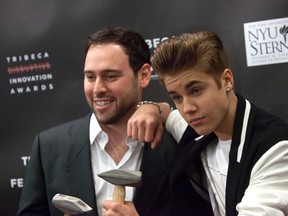 Scooter Braun and Justin Bieber attend the third annual Tribeca Disruptive Innovation Awards during the 2012 Tribeca Film Festival at NYU Paulson Auditorium in New York April 27, 2012. (REUTERS/Andrew Kelly)