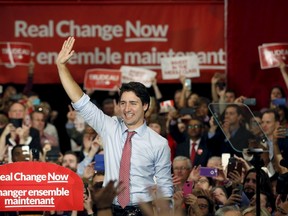 Liberal leader and Canada's Prime Minister-designate Justin Trudeau waves to supporters at a rally in Ottawa, October 20, 2015. Bringing the Liberal party back from the dead was a monumental undertaking for Justin Trudeau, but there are big challenges ahead. REUTERS/Patrick Doyle